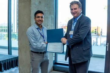 Farhad Omidvar receiving award from CMC CEO Gord Harling